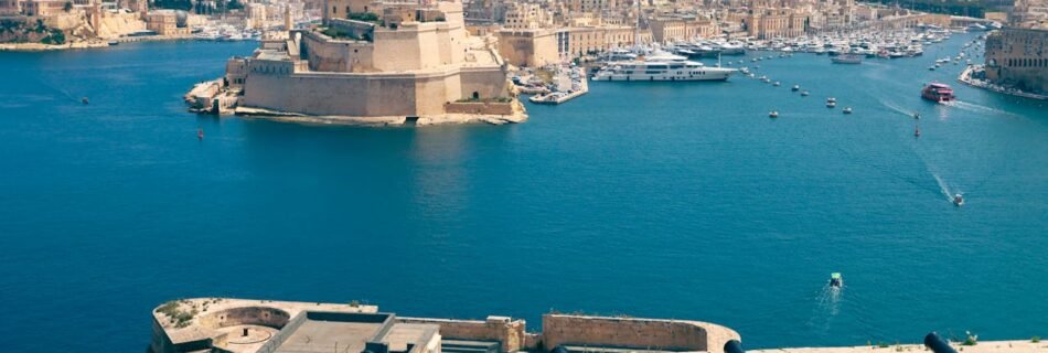 Historic center of Valletta, Malta, with limestone buildings, narrow streets, and Mediterranean charm under clear blue skies.