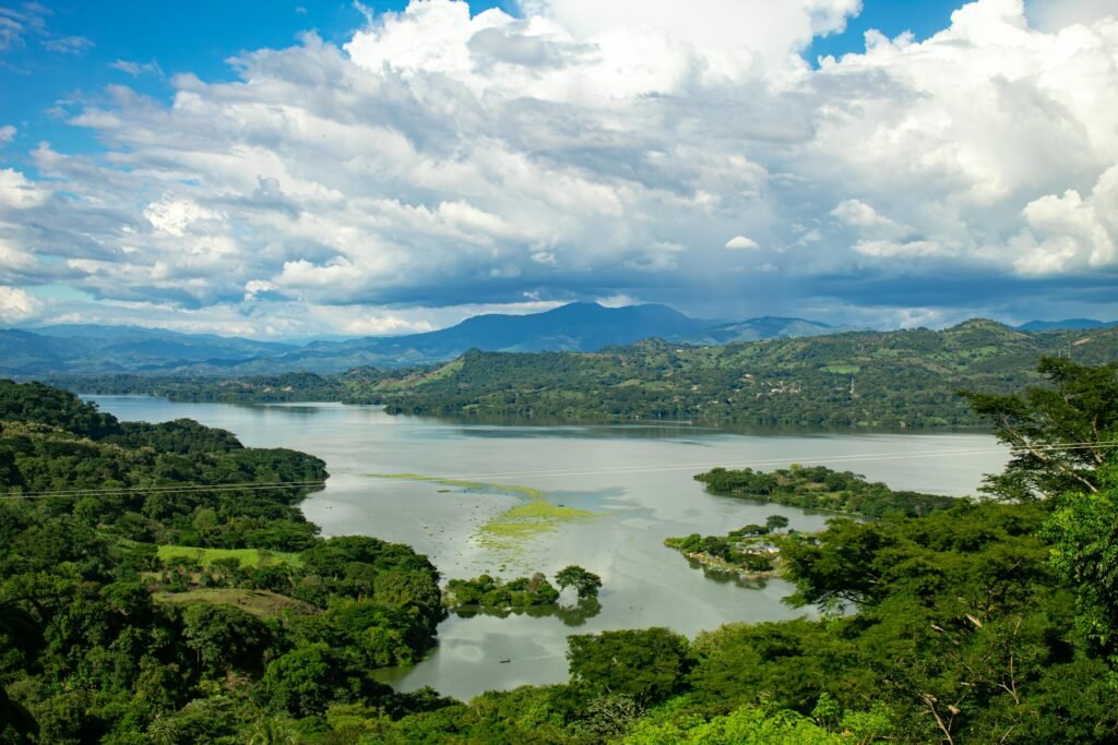 Panoramic view of Lake Suchitlán and the green hills of Suchitoto, showcasing one of the most beautiful cities in El Salvador!